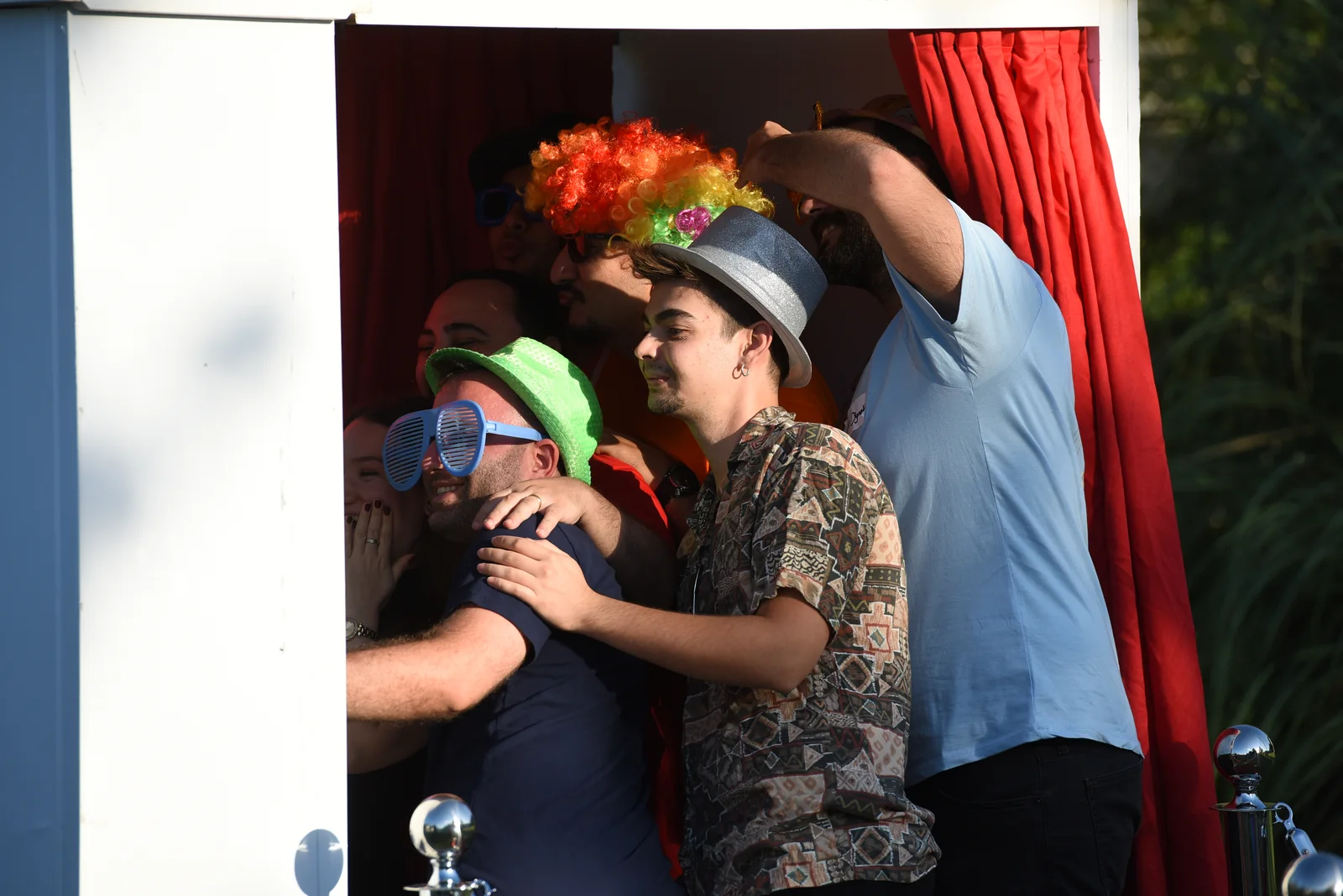 Virgosol team members smiling in a photo booth at an event